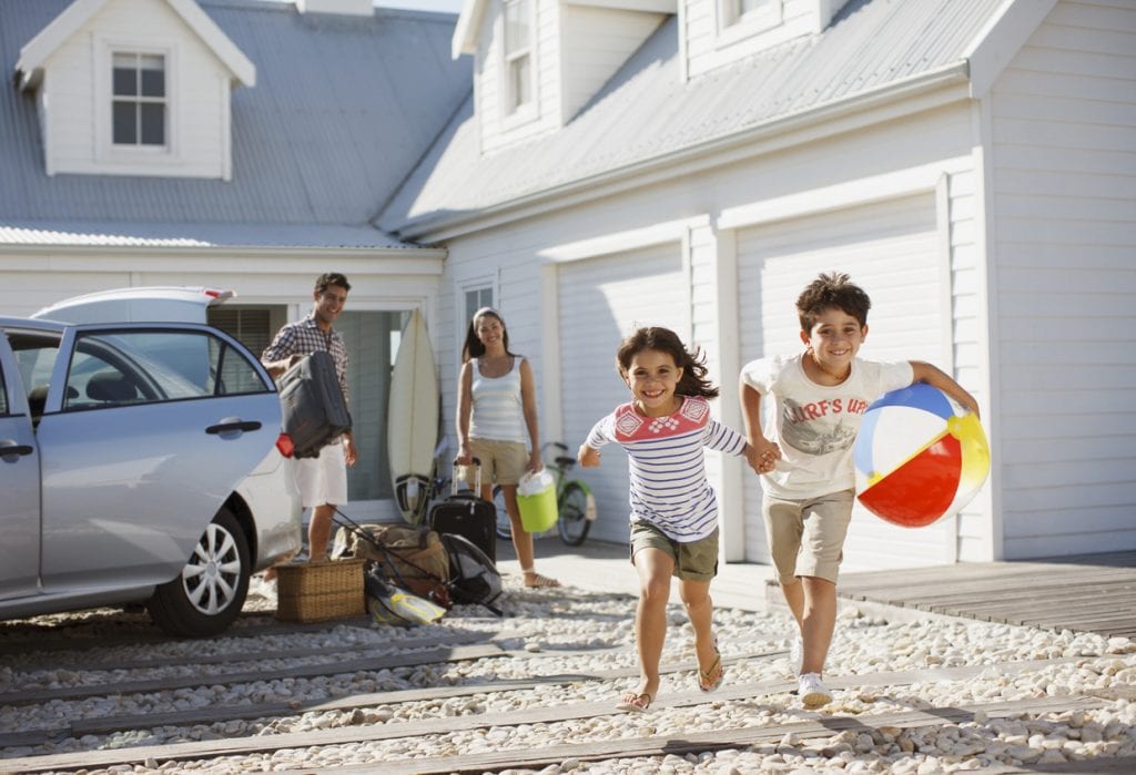 happy family visiting their vacation home