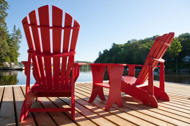 red wooden deck chair of a waterfront home